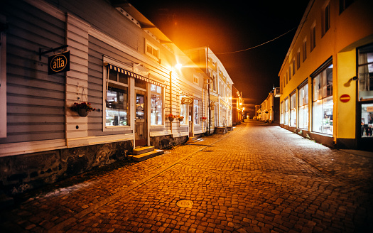 Porvoo, Finland - Wooden shop buildings in old town main street by night