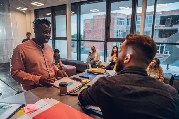 istock Two business man having a meeting in an open space office 1397799872