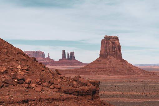 Dawn at Monument Valley Tribal Park with Beautiful Desert Sand in Front of the Majestic Mitten Bluffs of the Tribal Park