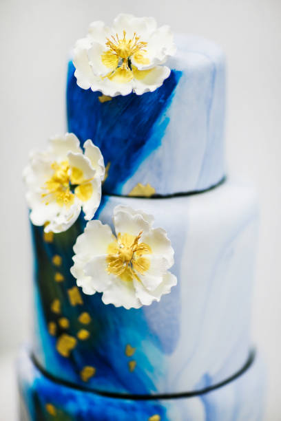 istock Multilevel blue wedding cake with flowers 1397802815
