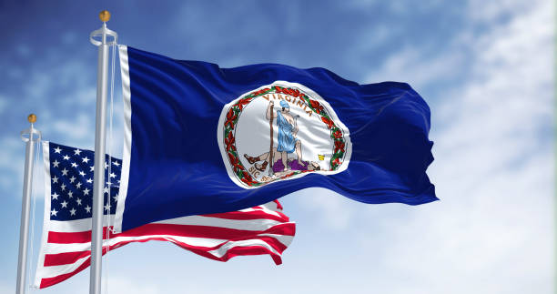 The Virginia state flag waving along with the national flag of the United States of America The Virginia state flag waving along with the national flag of the United States of America. Virginia is a state in the Mid-Atlantic and Southeastern regions of the United States virginia us state stock pictures, royalty-free photos & images