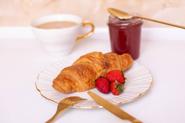 istock Coffee cup and croissant with fresh strawberry jam 1397806887
