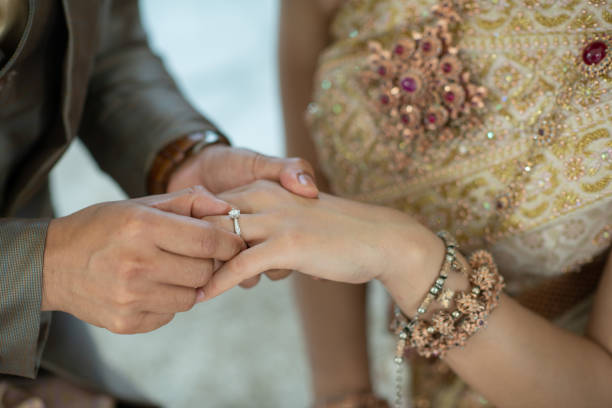 istock wear a ring, wedding ring, love couple 1397807932