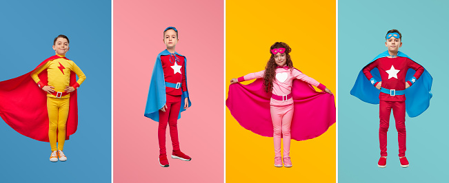 Colorful collage of brave kids wearing bright superhero cloaks standing in studio and looking at camera