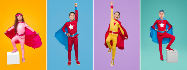 istock Cheerful kids in superhero costumes in studio 1397808933