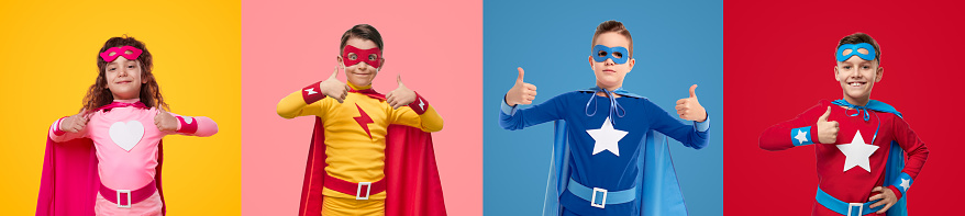 Colorful collage of delighted superhero children in bright costumes showing like gestures and looking at camera in studio