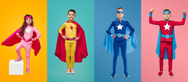 Collage of brave children in vivid superhero costumes standing on colorful backgrounds in studio and looking at camera