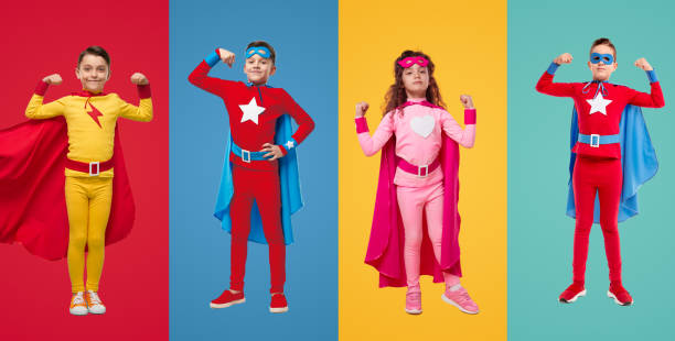 istock Kids in superhero costumes showing muscles 1397808965