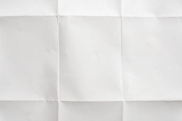 istock White folded and wrinkled paper texture background 1397808997