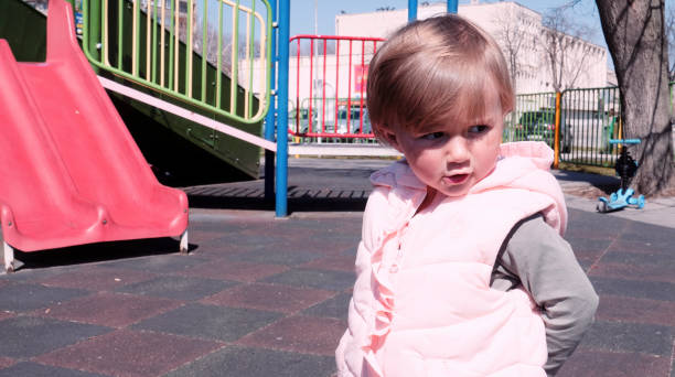 istock Baby playing on a playground in spring. 1397809045