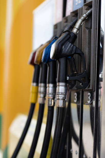 istock Filling pistol in his hand at gas station 1397809048
