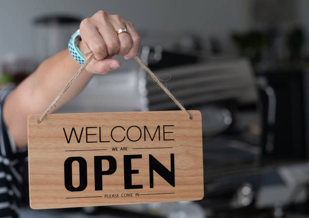 istock woman holding open label with blur background 1397810080