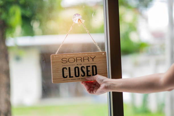 istock woman holding close label with blur background 1397810101
