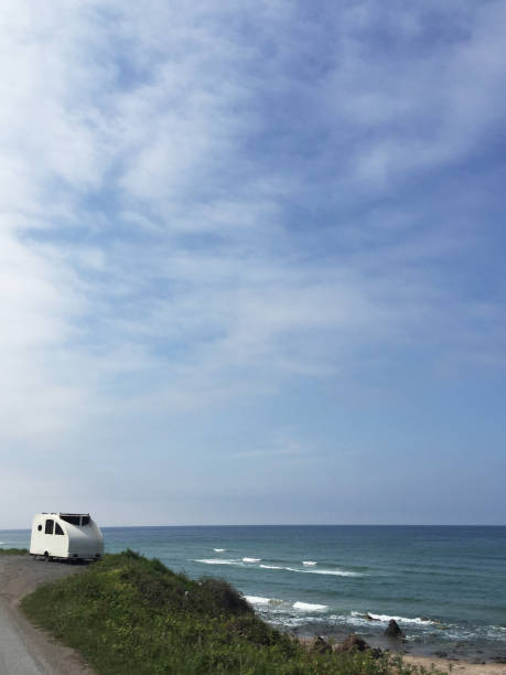 istock Caravan at the roadside with seascape 1397810107
