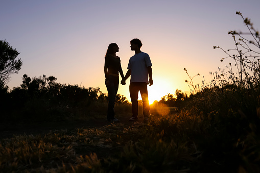 Young couple in field of flowers