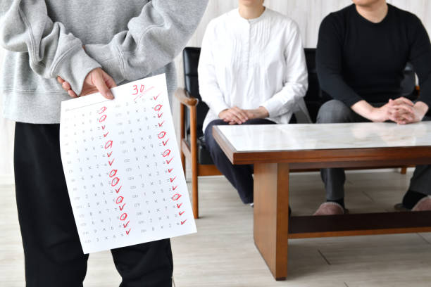 Child with bad score test and parents in living room stock photo