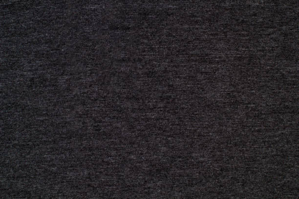 Black knitted fabric cotton textured background. Closeup with copy space for your design Black knitted fabric cotton textured background. Close up with copy space for your design heather grey stock pictures, royalty-free photos & images