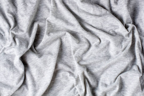 istock Grey crumpled fabric background for your design. Knitwear cotton abstract texture 1397815570