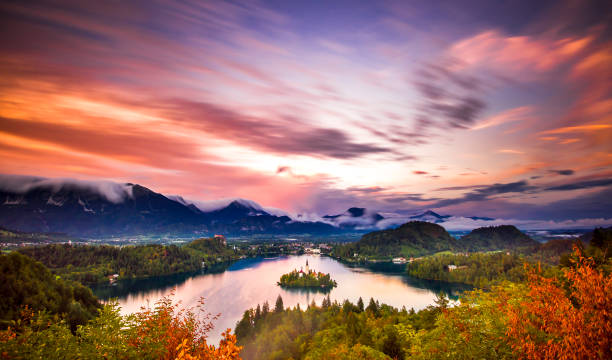 Lake Bled Slovenia. Beautiful mountain lake with small Pilgrimage Church. Most famous Slovenian lake and island. Sun set Lake Bled Slovenia. Beautiful mountain lake with small Pilgrimage Church. Most famous Slovenian lake and island. Sun set julian california stock pictures, royalty-free photos & images