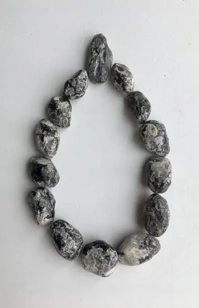 Healing crystals Apache Tear rough obsidian in a teardrop shape