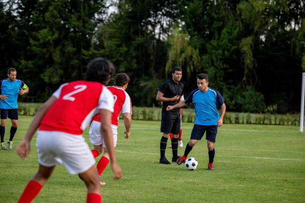 istock Competitive soccer players playing in the field 1397817672