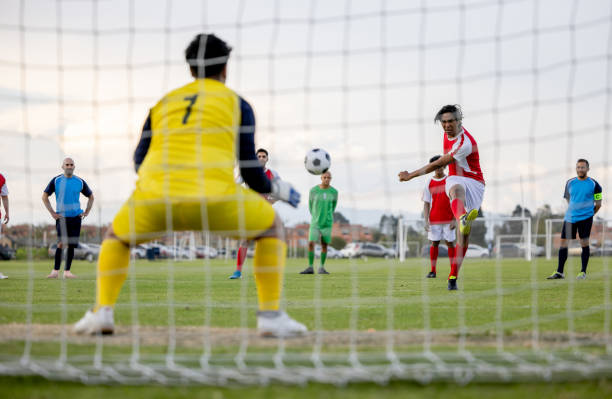 istock Soccer player taking a penalty kick while playing a game 1397817776