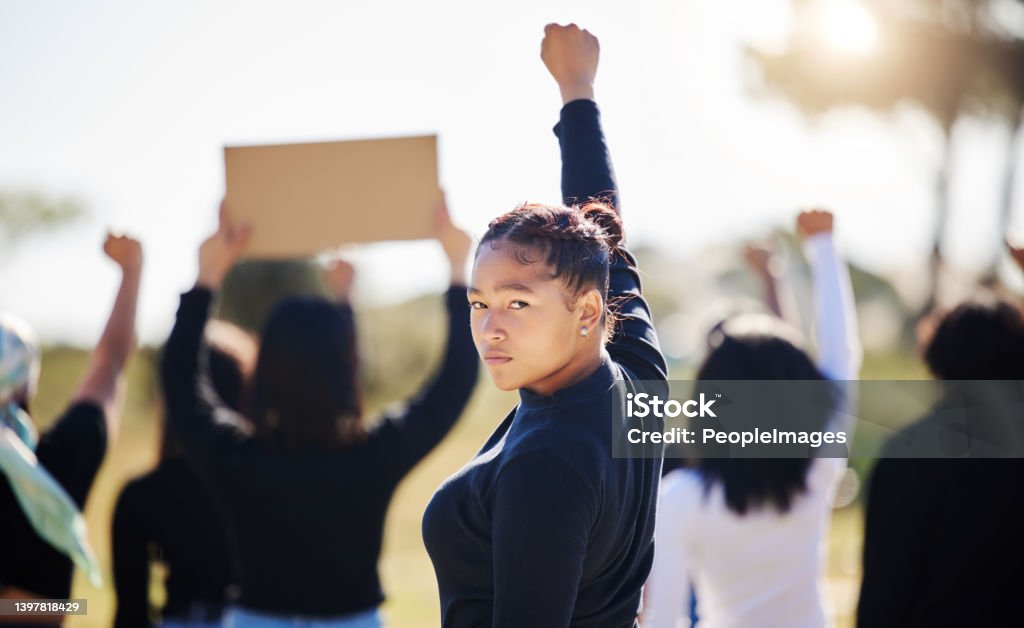 Shot of a group of people protesting climate change To pander like a slave to your wants Rebellion Stock Photo