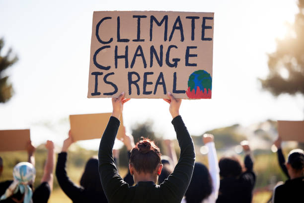 istock Shot of a group of people protesting climate change 1397818439