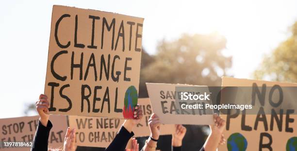 Shot Of A Group Of People Protesting Climate Change Stock Photo - Download Image Now