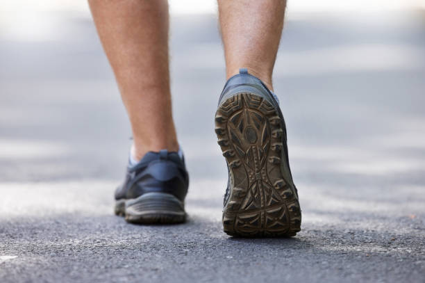 closeup shot of an unrecognisable man running outdoors - base runner imagens e fotografias de stock