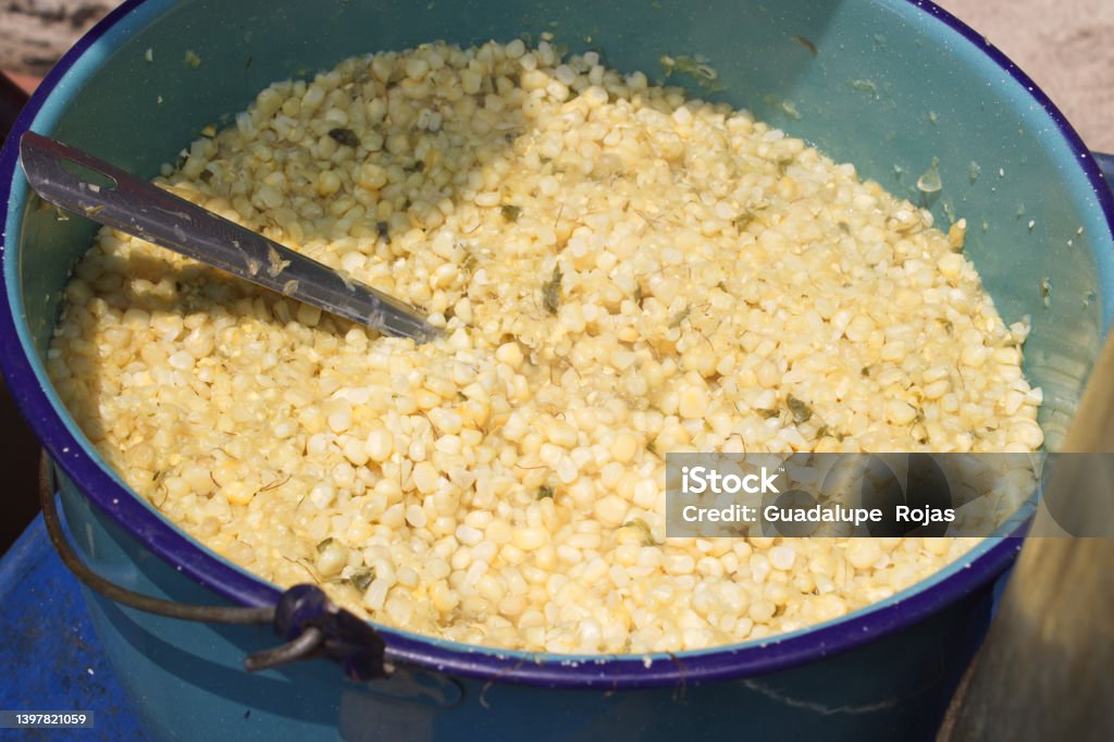 Corn kernels in a blue pot, known as Esquites Appetizer Stock Photo