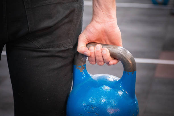lifting kettlebell for biceps ripl fitness