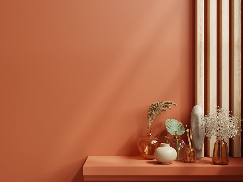 Maqueta de estante en habitación vacía moderna, pared de color naranja oscuro. photo