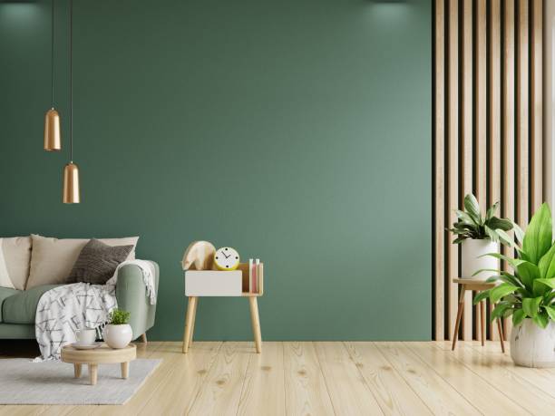 istock Green sofa with table on green wall and wooden flooring. 1397825701