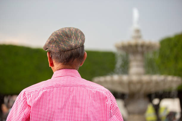 Portrait of an 80-year-old man enjoying a public park.