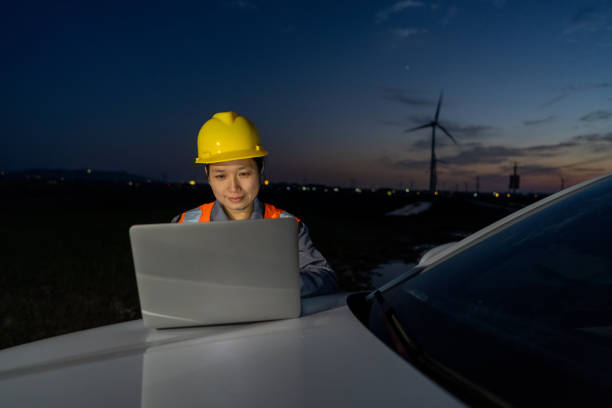 istock An Asian American wind power woman works 1397829073