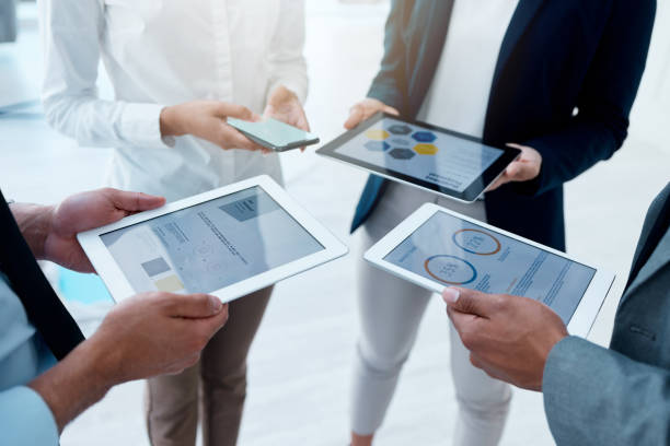 istock Shot of a unrecognizable team of colleagues using digital tablets and 1397829485