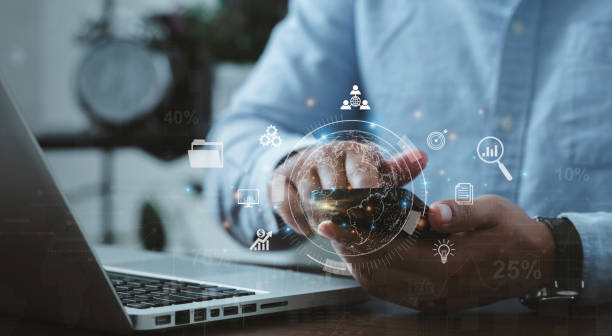 istock Man using mobile smartphone shows the future world of the metaverse with internet technology icons, Digital Marketing, Financial and banking, Metaverse, Digital link tech, and Big data concept. 1397833529
