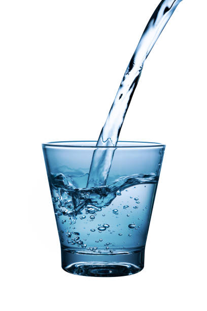 istock pouring water in glass with reflection on white background 1397833688