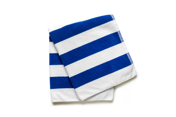 istock Blue stripped beach towel isolated on white, flat lay top view shot 1397833777