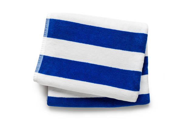 istock Blue stripped beach towel isolated on white, flat lay top view shot 1397833780
