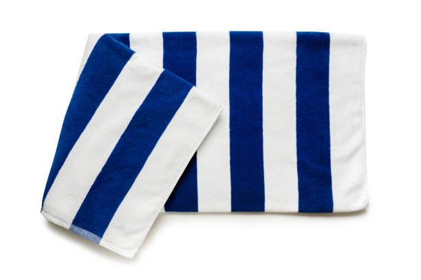 istock Blue stripped beach towel isolated on white, flat lay top view shot 1397833783