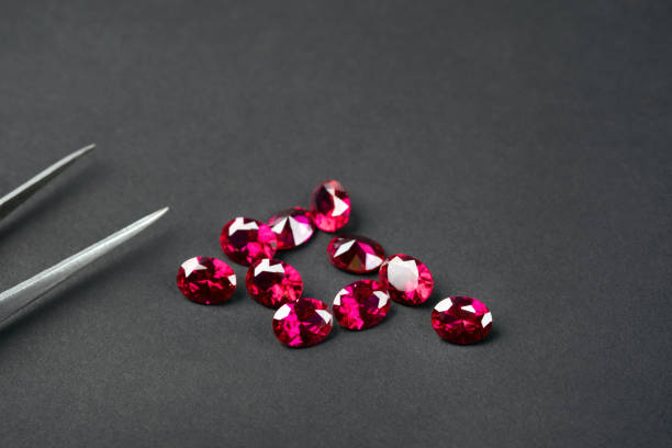 Red Ruby gemstone Round Cut on black background, close up shot