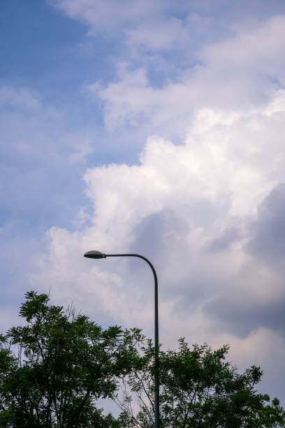 istock Dusk clouds and street lights 1397836354