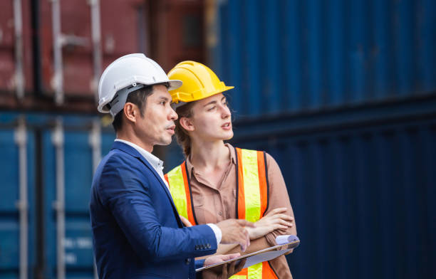 istock Supervisor and worker in the container yard, Industrial engineer and inspector or safety supervisor working in container terminal, Logistics concepts 1397836586
