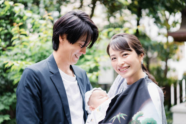 istock Young couple holding a baby 1397838438