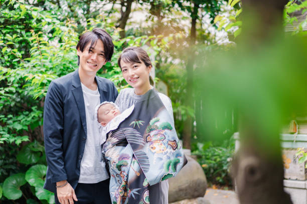 istock Young couple holding a baby 1397838443
