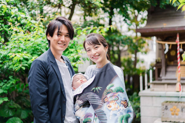 Young couple holding a baby