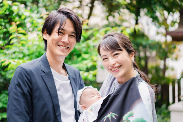 istock Young couple holding a baby 1397838473
