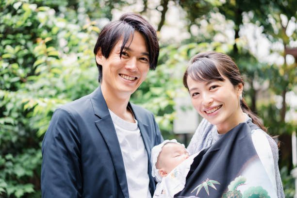 istock Young couple holding a baby 1397838476